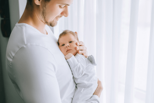 new dad holding baby