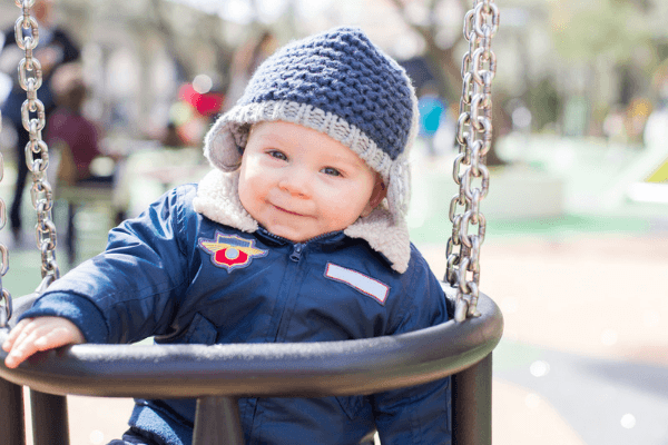 cute baby boy on a swing